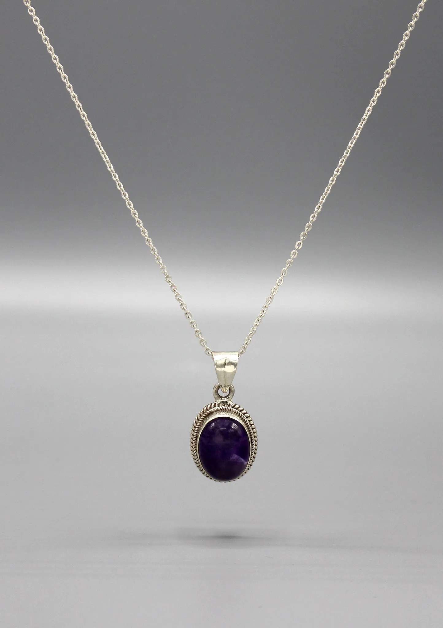 Charming Amethyst Inlaid Sterling Silver Pendant